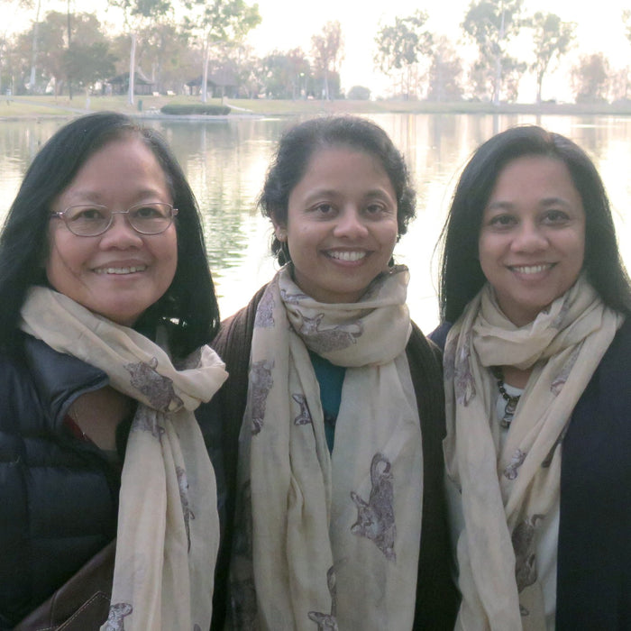 ann, sheila, lisa satin of satin crystals posing by a lake