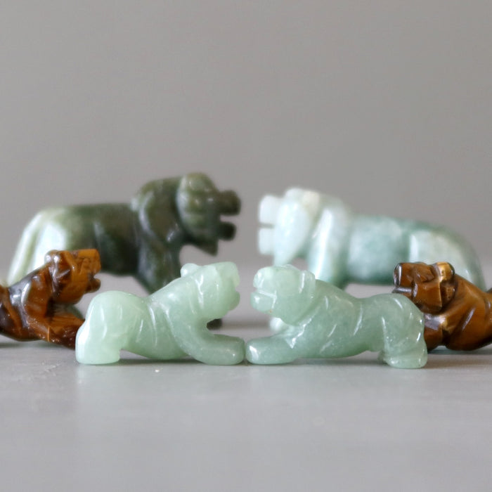 green aventurine, jade, and brown tigers eye tiger figurines