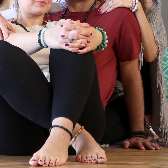 group wearing beaded anklets and bracelets
