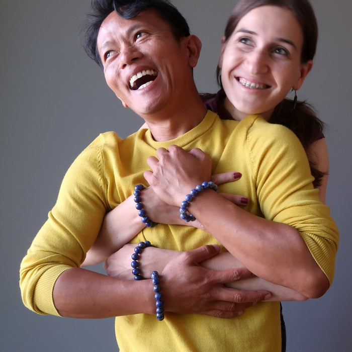 man and woman wearing lapis lazuli stretch bracelets