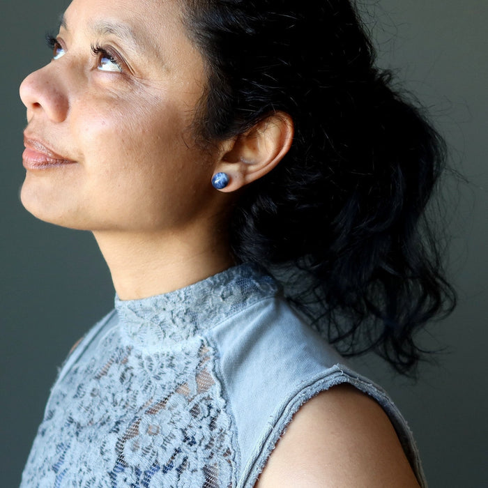 woman wearing sodalite stud earrings