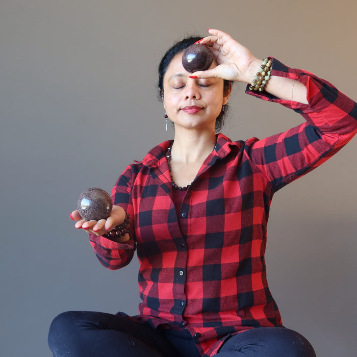 sheila of satin crystals meditating with garnet spheres