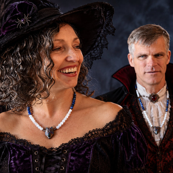 man and woman wearing wolf jewelry in halloween costumes