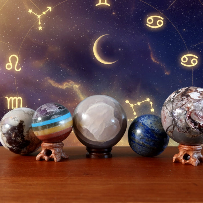 crystal balls in a zodiac background