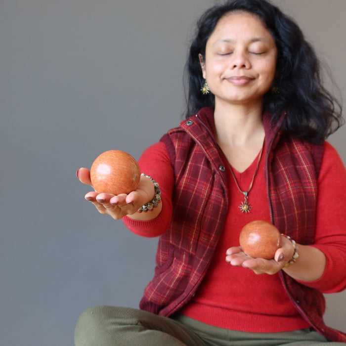 sheila of satin crystals meditating with red jasper spheres