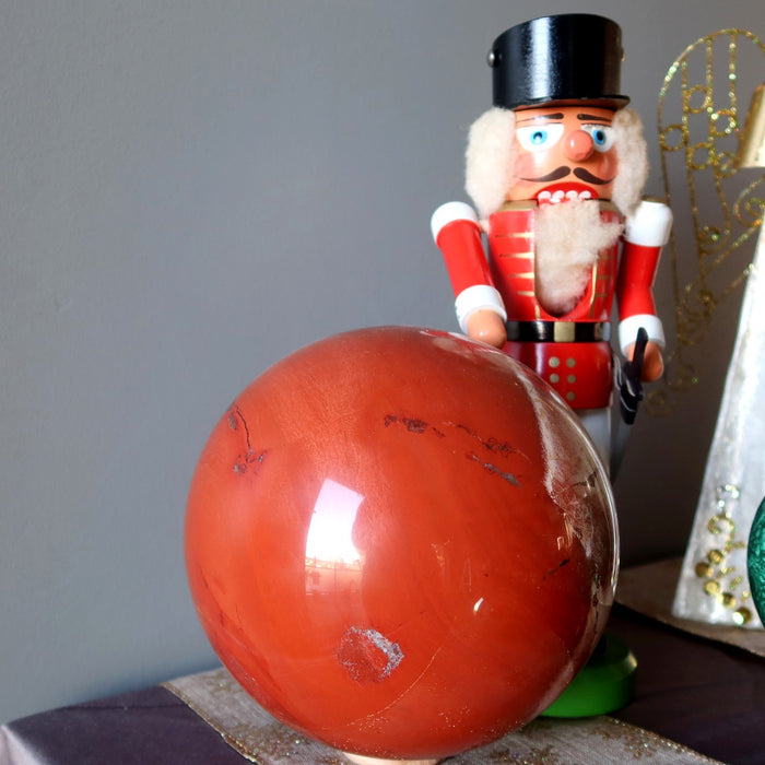 red jasper sphere, wooden nutcracker, gold angel, green malachite sphere