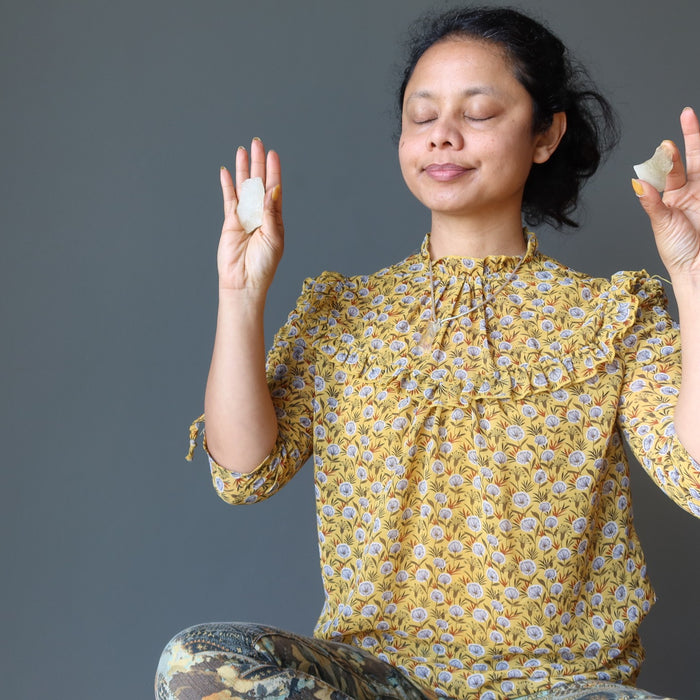 sheila of satin crystals meditating with yellow tektite libyan desert glass in her hands