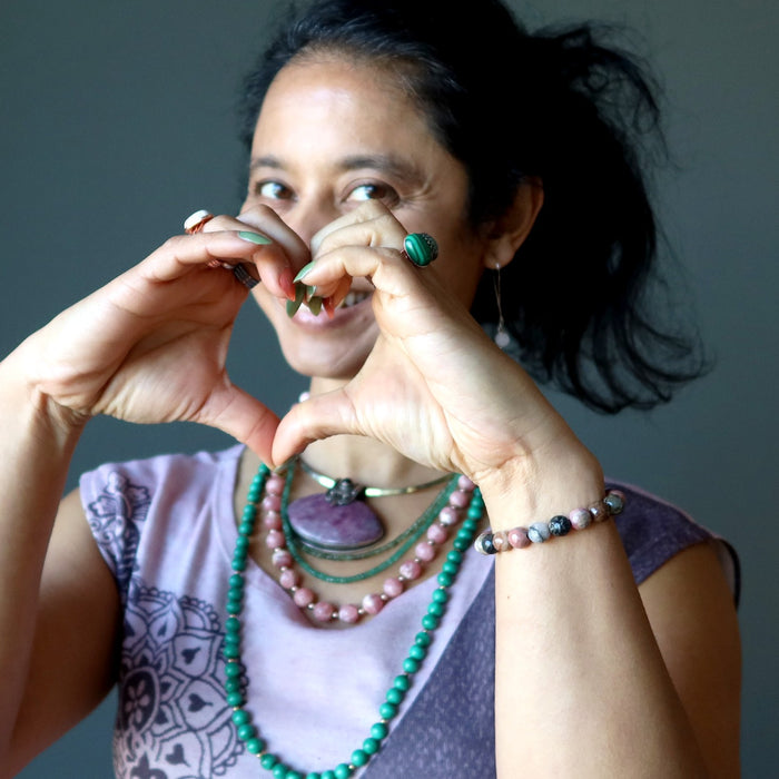 sheila of satin crystals wearing pink and green love jewelry