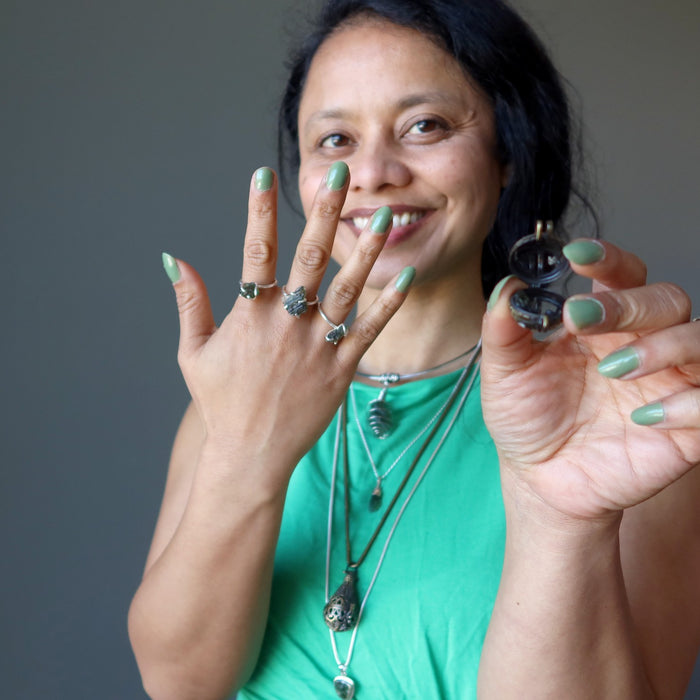 sheila of satin crystals wearing moldavite jewelry