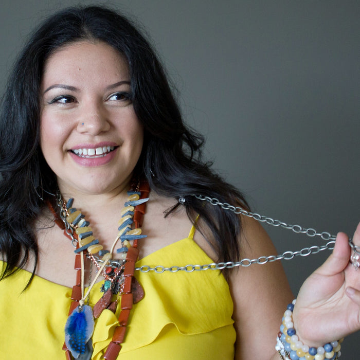 woman wearing crystal necklaces