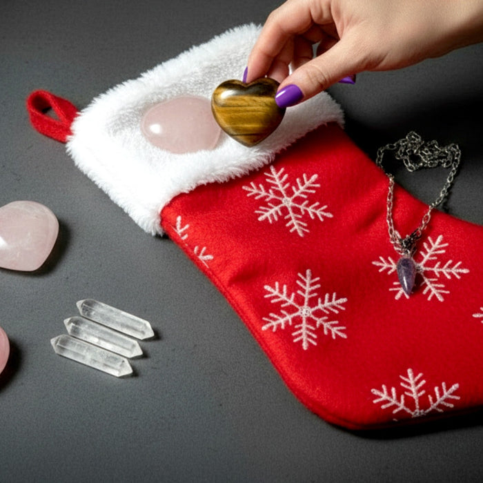 hand placing crystals in christmas stocking