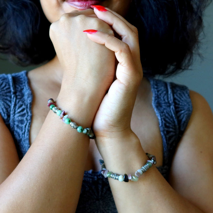 woman wearing crystal bracelets