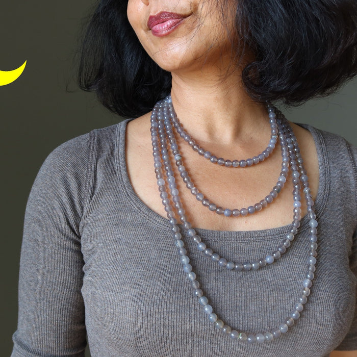 woman wearing gray chalcedony necklaces