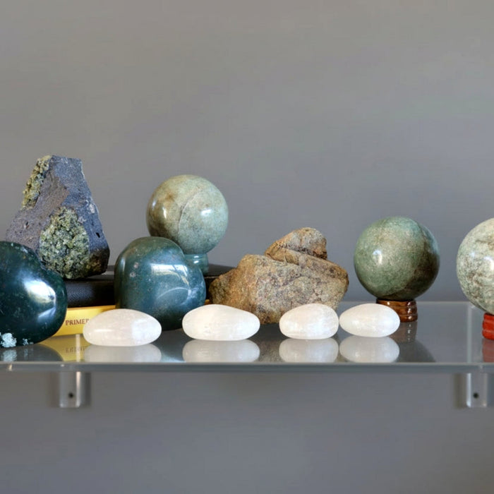 stones on a glass shelf