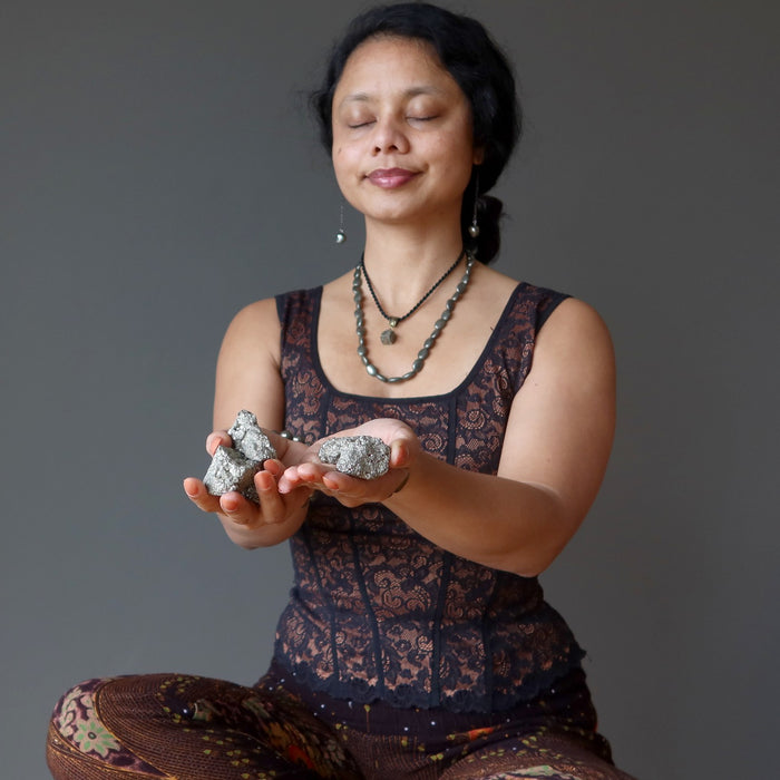 sheila of satin crystals meditating with pyrite clusters