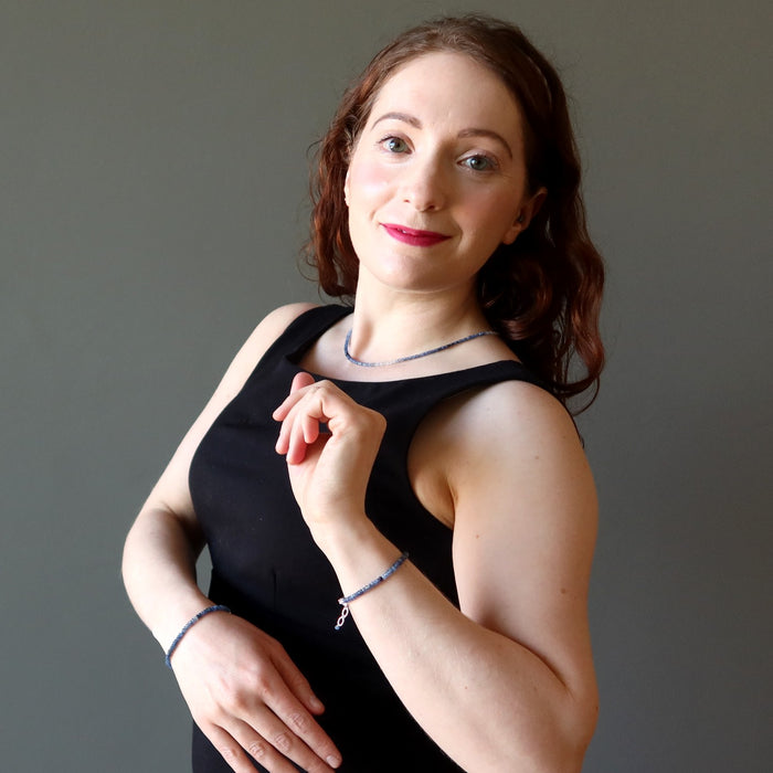 woman wearing sapphire necklace and bracelets
