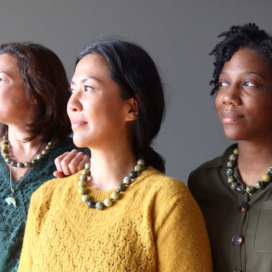 women wearing serpentine necklaces