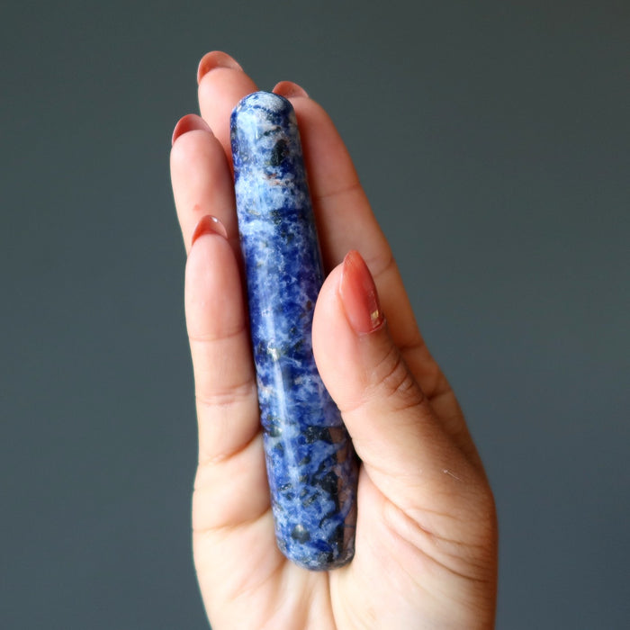 hand holding sodalite massage wand