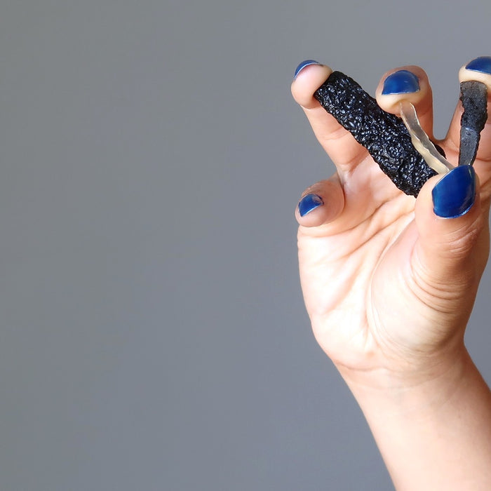 hand holding tektites