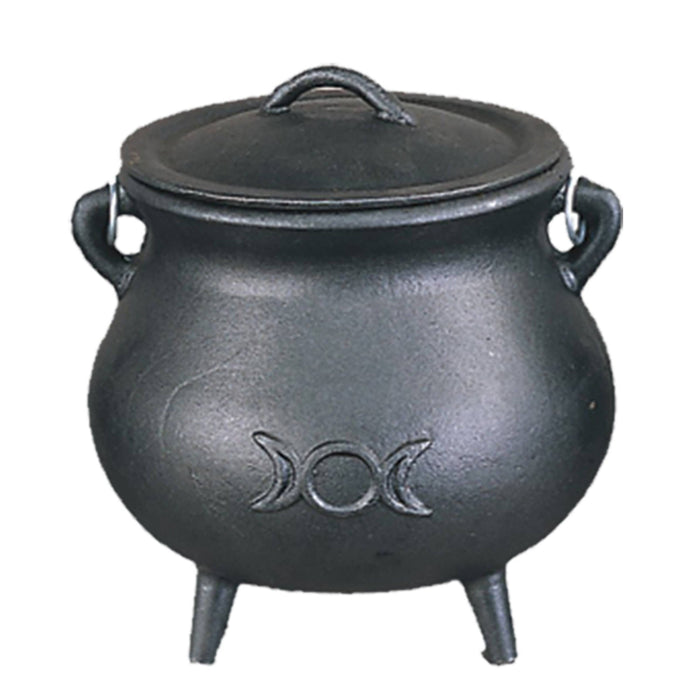 Black cast iron cauldron with lid on a white background