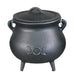Black cast iron cauldron with lid on a white background