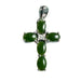 Green jade cross pendant with silver accents on a beige background