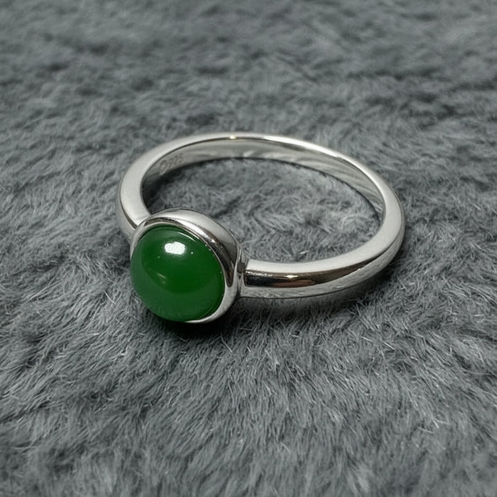 Silver ring with a green jade gemstone