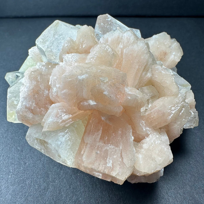 Zeolite crystal cluster on a dark gray background