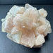 Zeolite crystal cluster on a dark gray background