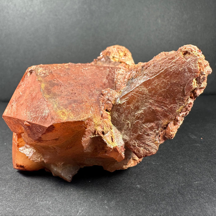 tangering quartz mineral rock on a dark gray background