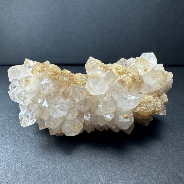 Crystal cluster on a dark gray background