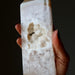 Hand holding a textured Agate with Druzy Quartz crystal