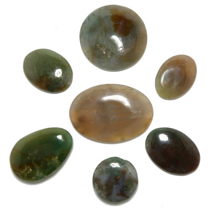 Set of polished gemstones on a white background