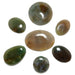 Set of polished gemstones on a white background