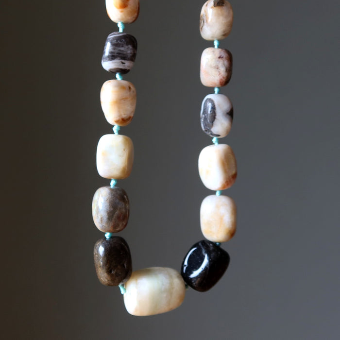 Amazonite Necklace with multicolored beads on a dark background