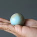 amazonite sphere in hand