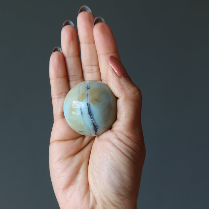 amazonite sphere in hand