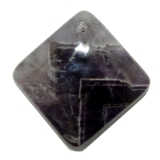 Pyramidal Amethyst crystal on a white background