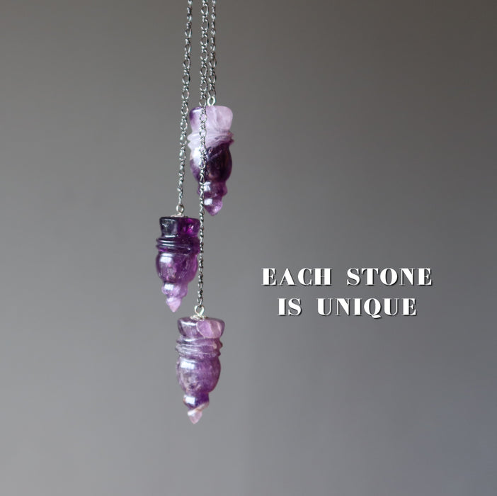 three amethyst pendulums
