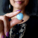 blue aquamarine tumbled stone at throat chakra