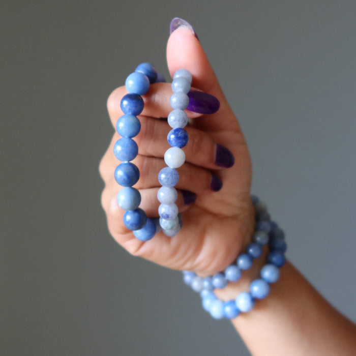 wearing and holding blue aventurine bracelet