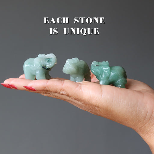 three green aventurine elephants