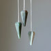 three green aventurine pendulums