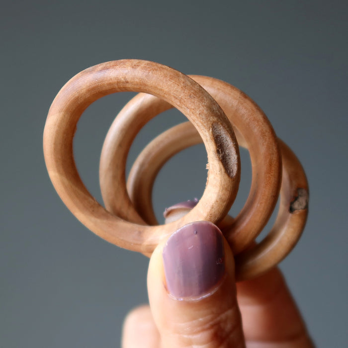 three wood ring stands