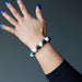 bloodstone howlite beaded bracelet on wrist