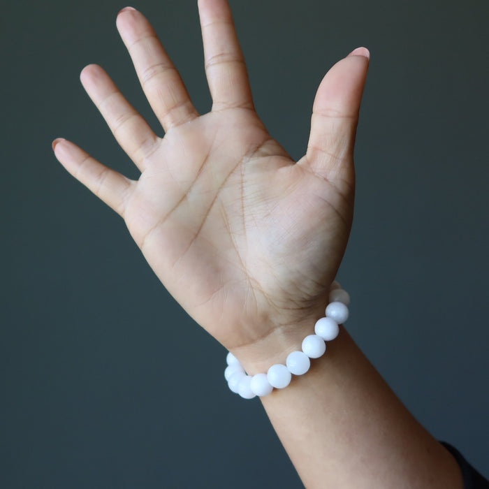 pink mangano calcite bracelet on wrist