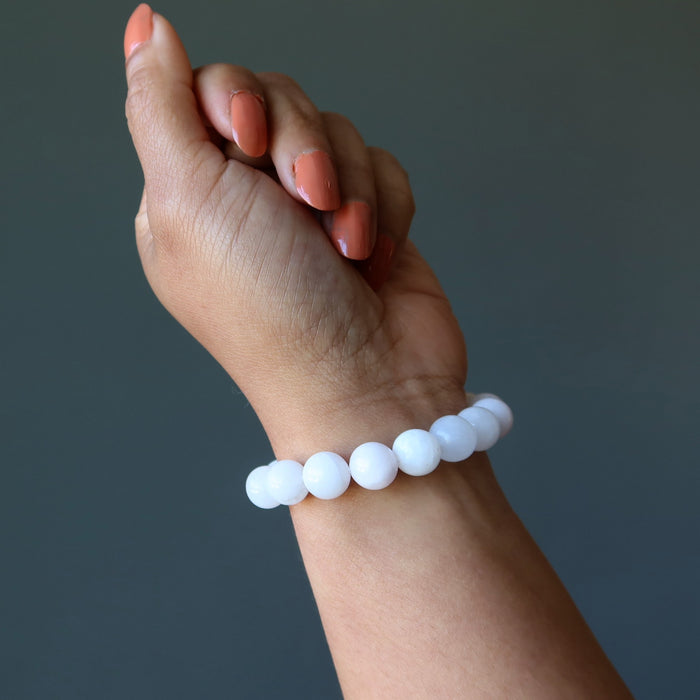 pink mangano calcite bracelet on wrist