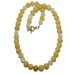 Calcite Necklace with yellow and white beads on a white background