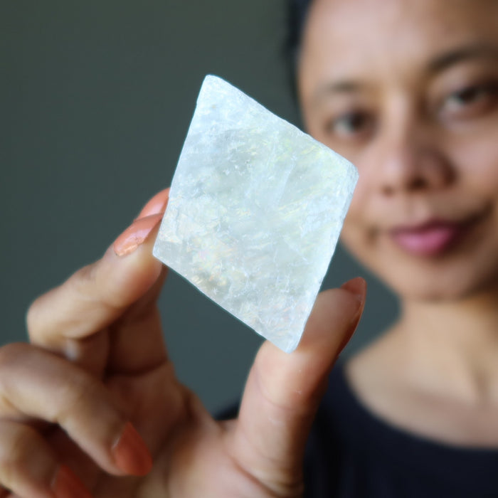 woman admiring optical calcite crystals