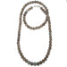 Long necklace with gray chalcedony beads on a white background